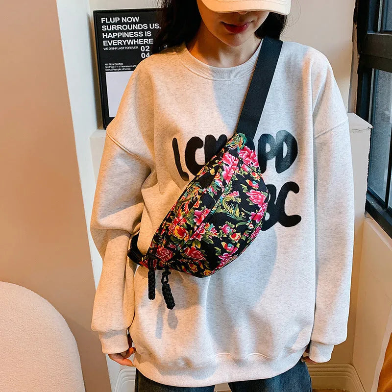 Women's floral Western style waist bag with three-dimensional pocket in black, red, green or blue colour options
