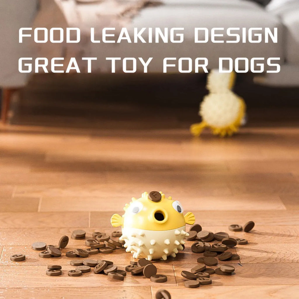 Yellow fish-shaped dog chew toy with textured surface and squeaker function