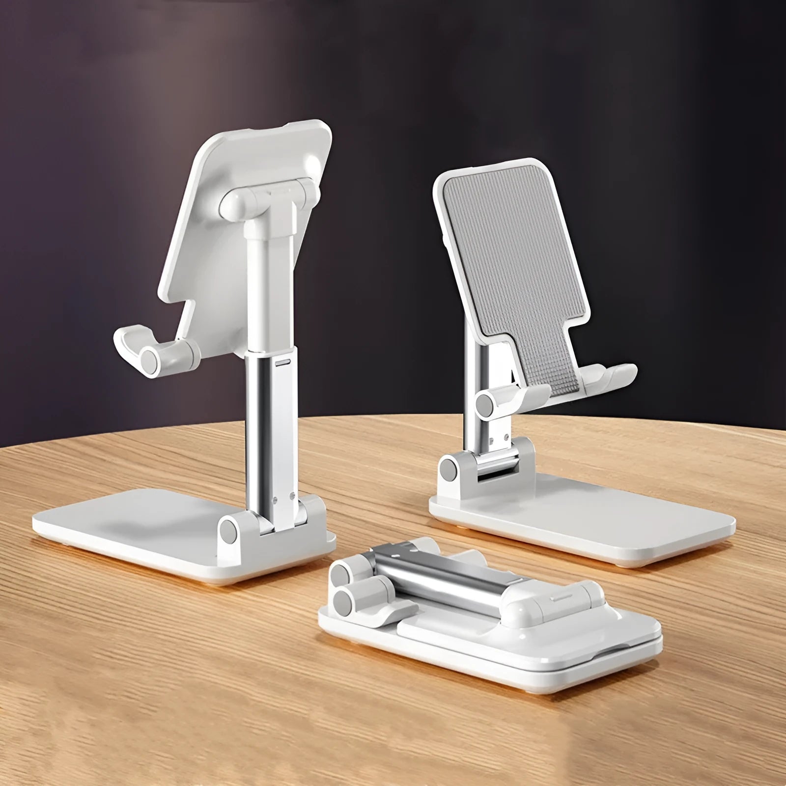 Live Selfie folding telescopic mobile phone bracket in white with silicone pad on desktop