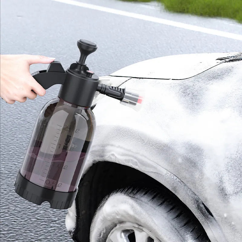 Black hand-held foam sprayer with 2L capacity, ergonomic handle, and switch lock for gardening and car washing.