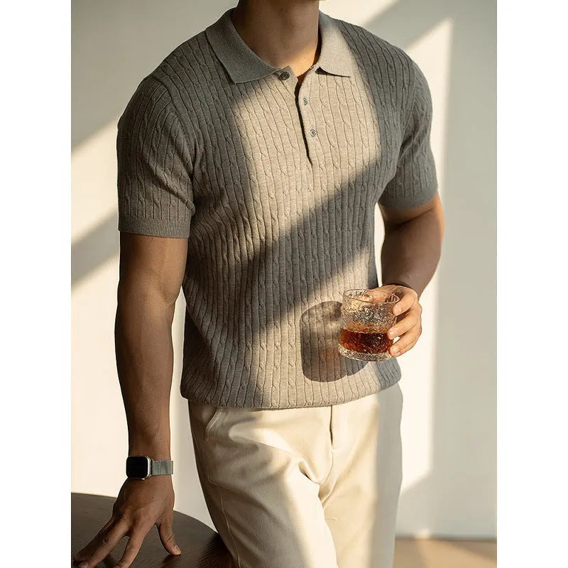 Men's khaki short-sleeve business top on a hanger, showing button placket and tailored fit.