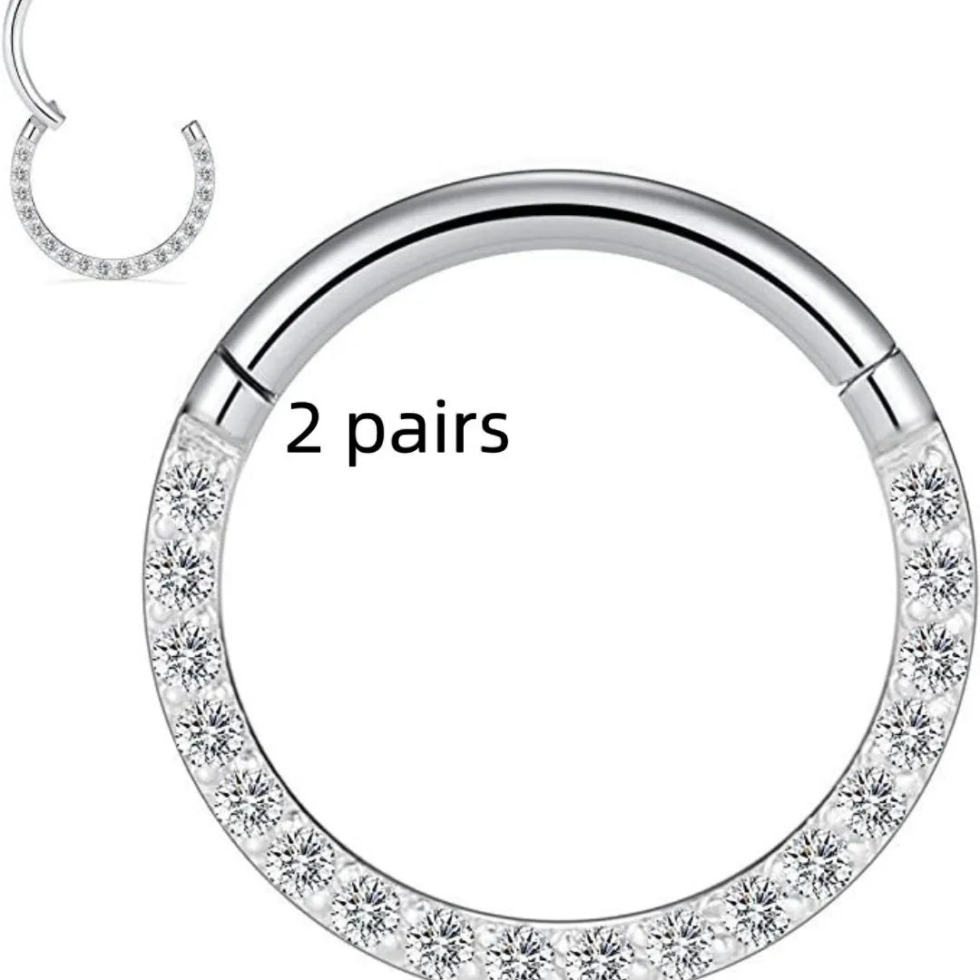Two pairs of round, seamless 316 stainless steel nose rings showing black, gold, rose gold, and steel colour finishes.