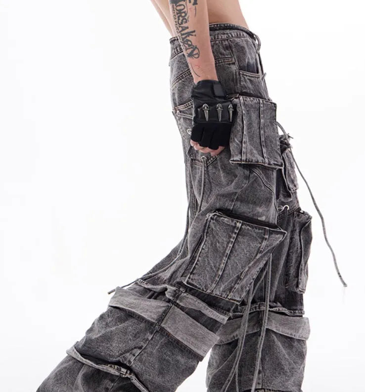 Grey distressed denim men's overalls with rope stitching and mop pant leg style