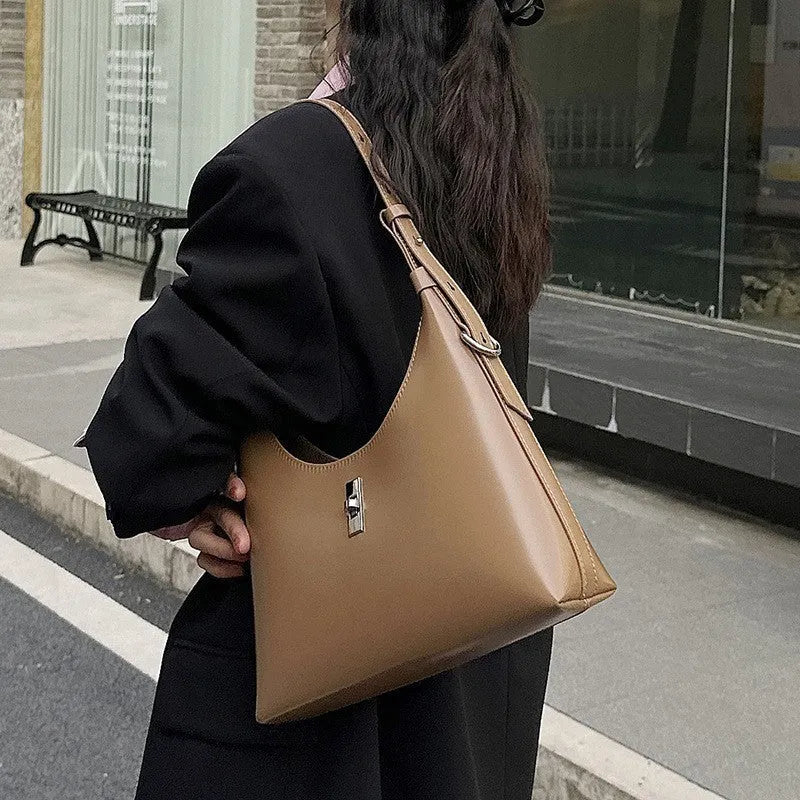Genuine leather crossbody shoulder bag in dumpling shape with sandwich pocket design