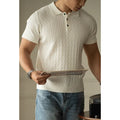 Men's khaki short-sleeve business top on a hanger, showing button placket and tailored fit.