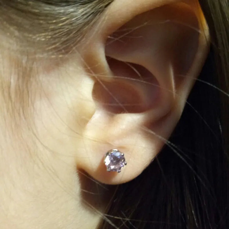 Disposable ear piercing gun with built-in crown stud in 316L stainless steel with zirconium inlay