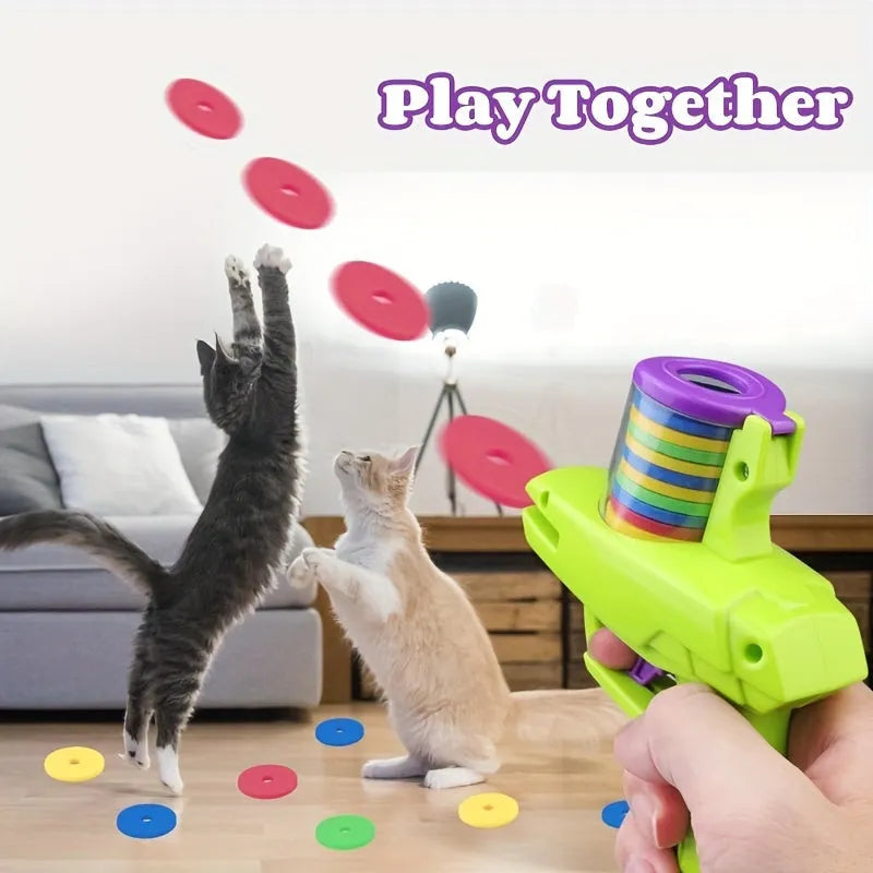 Interactive cat toy launcher with foam discs in green or purple colour options