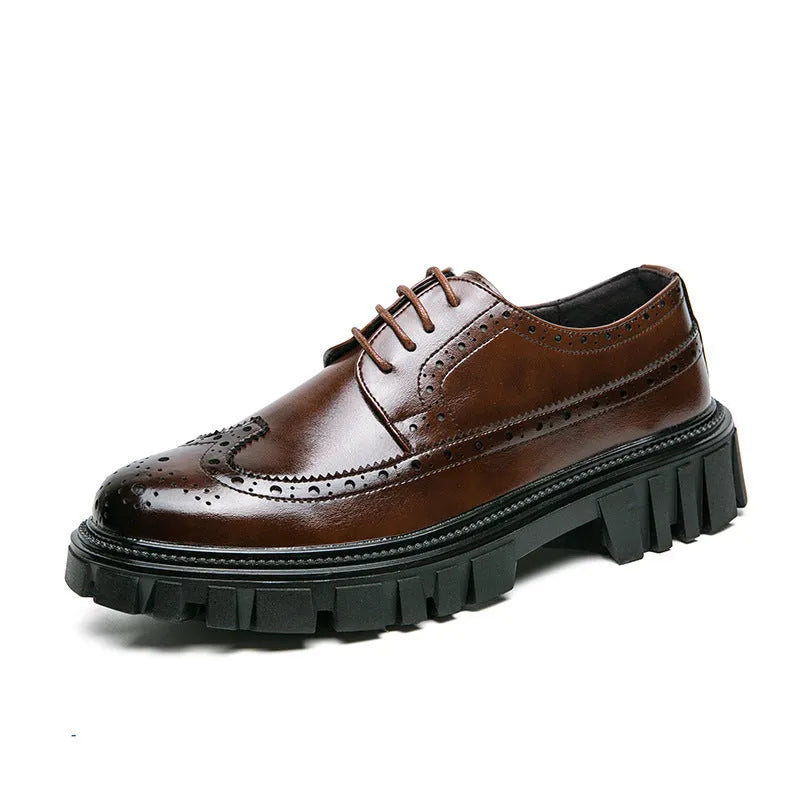 Men's black leather brogue shoes with round toe design on solid background