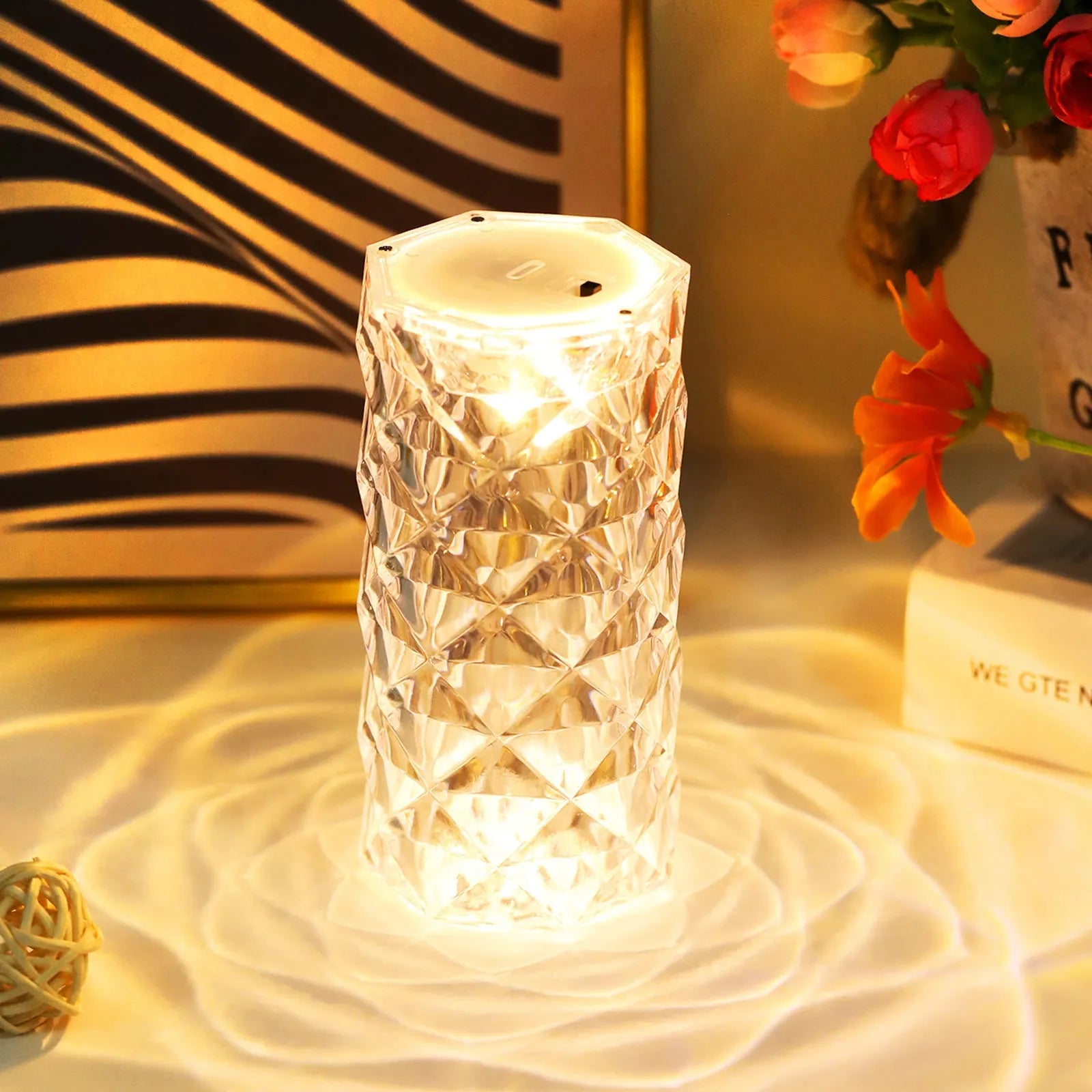 Clear acrylic crystal rose petal table lamp with plastic LED, warm white light, compact 12.2cm size on a desk