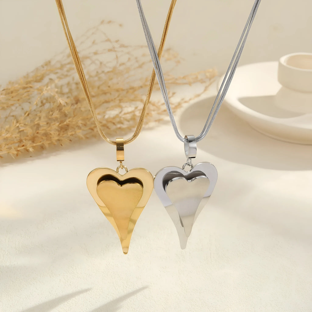 Women's stainless steel necklace with geometric double heart snake bones pendant in gold or steel finish