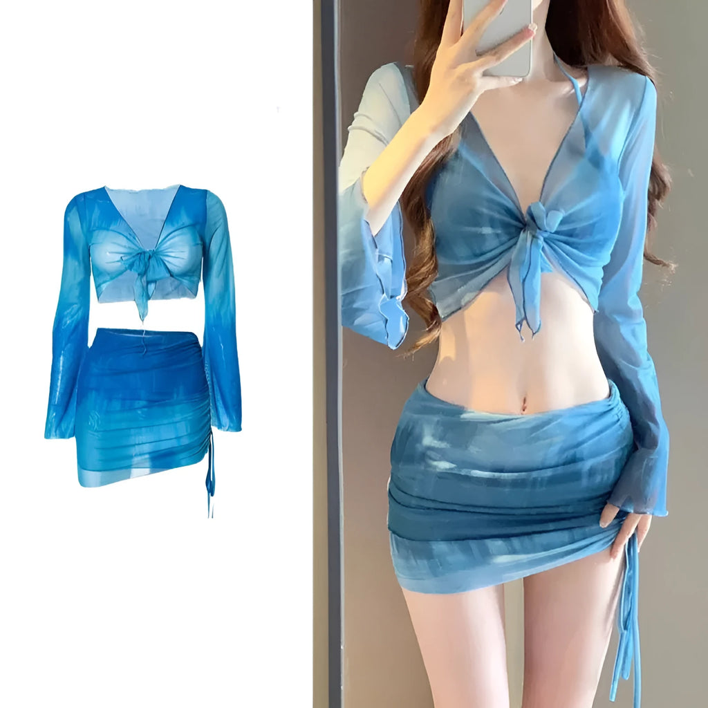 Women's blue four-piece bikini swimsuit set with high-waist briefs and ruffle skirt