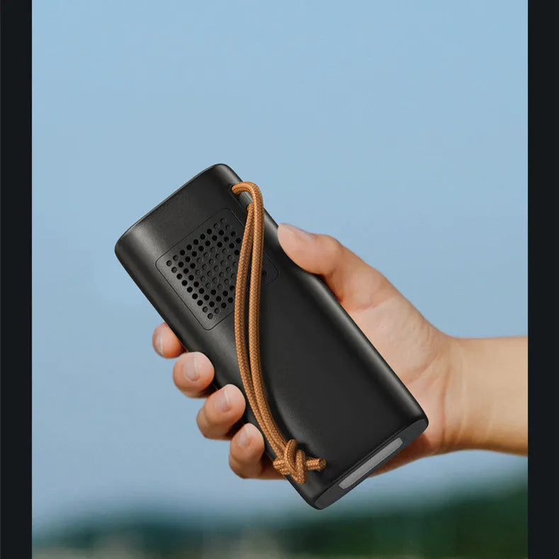 Black portable power bank with 220V AC output and solar charging panel, dimensions 70x70x162mm.