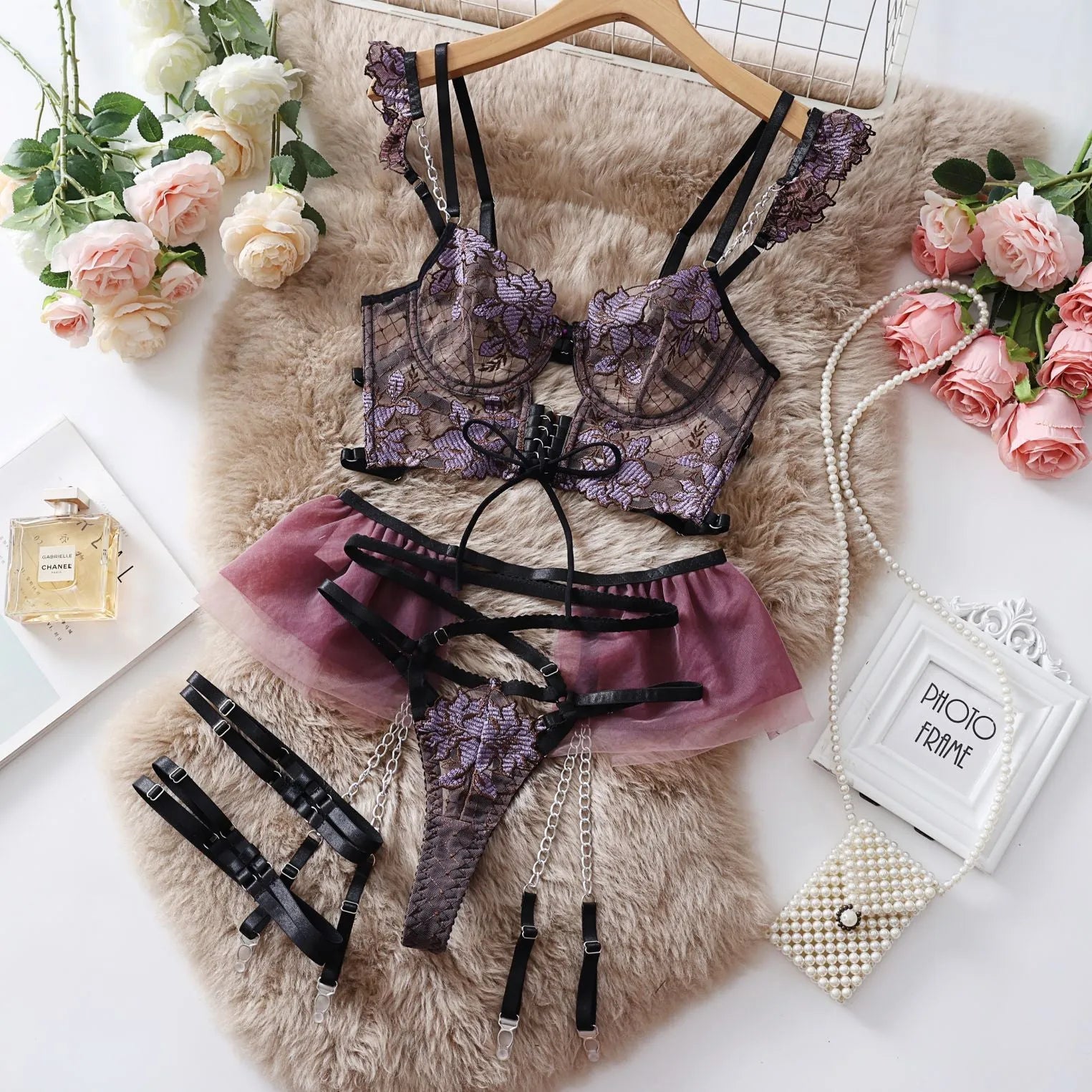 Light blue embroidered lace push-up bra and mesh pants lingerie set on a neutral background.