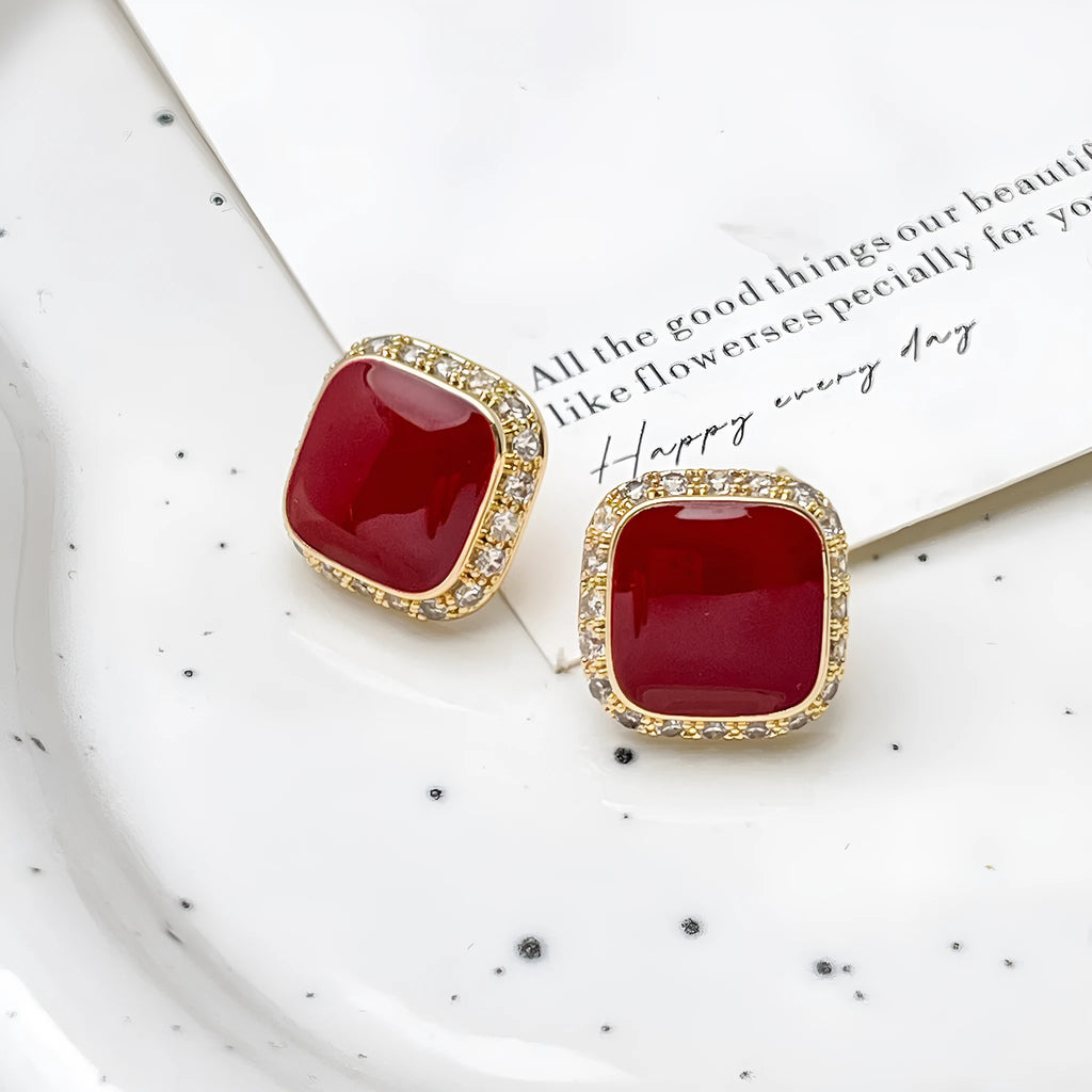 Red square plate earrings with geometric alloy construction and retro styling