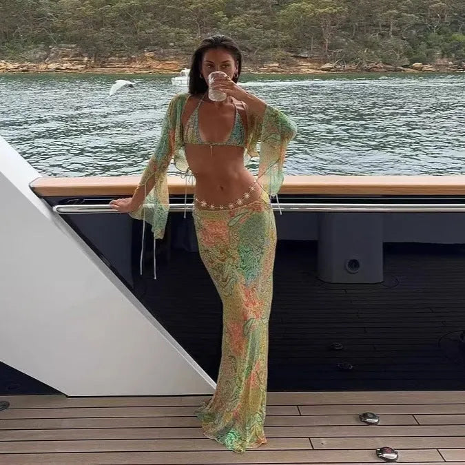 Green halterneck printed lace-up split swimsuit with long bell sleeves on model