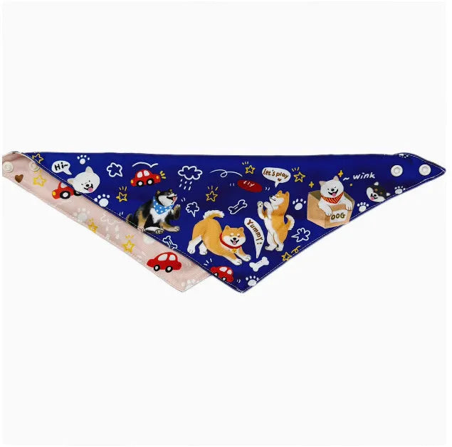 Shiba Inu wearing a pink with blue reversible triangular bandana tied around its neck, with a water towel placed alongside