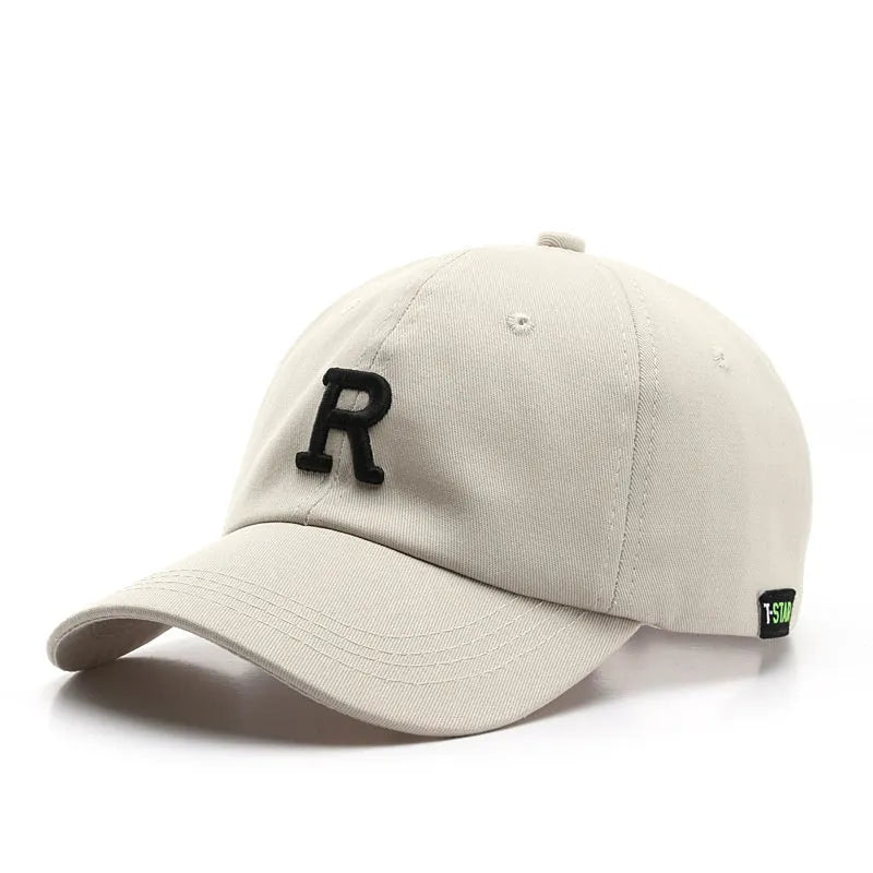 Adjustable unisex baseball cap with embroidered letter R in black cotton satin weave with brim