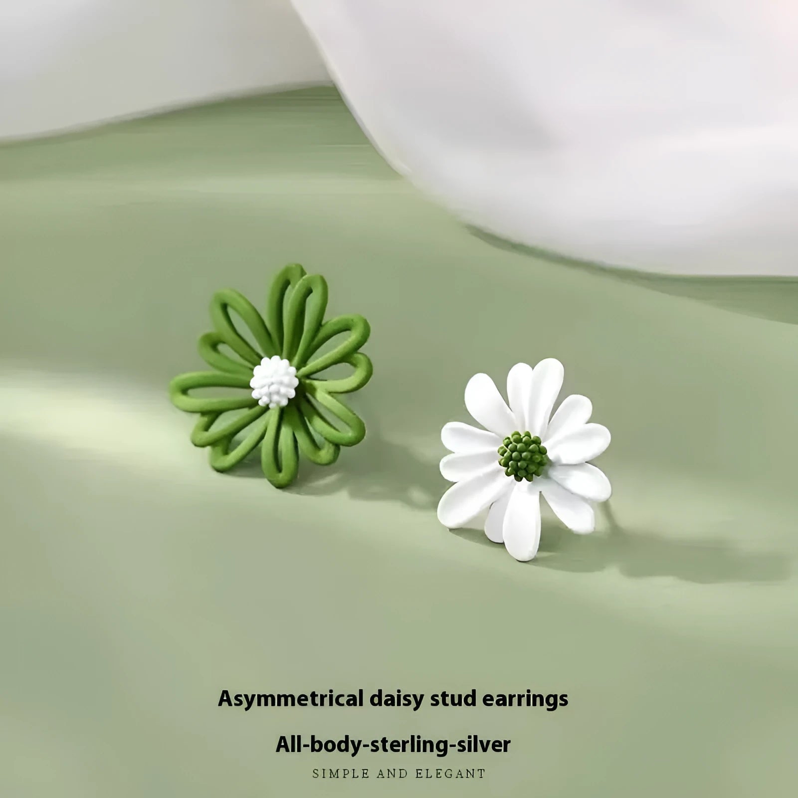 A pair of alloy cartoon flower stud earrings in blue and orange two-tone colours.