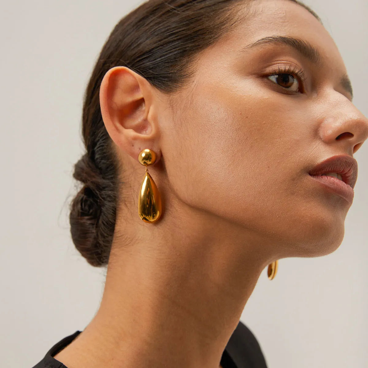 Gold electroplated stainless steel water drop earrings with geometric hemisphere design