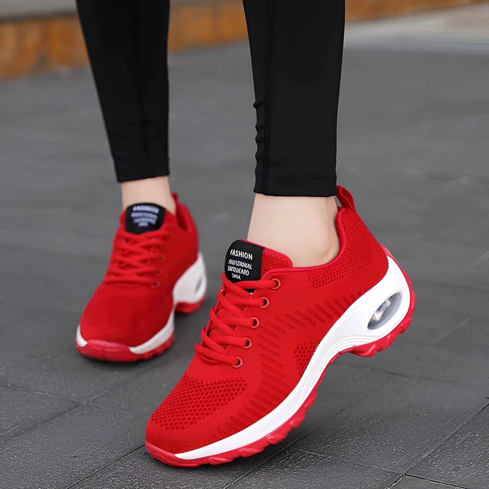 Women's black mesh lace-up sneakers with round toe and mid heel on white background