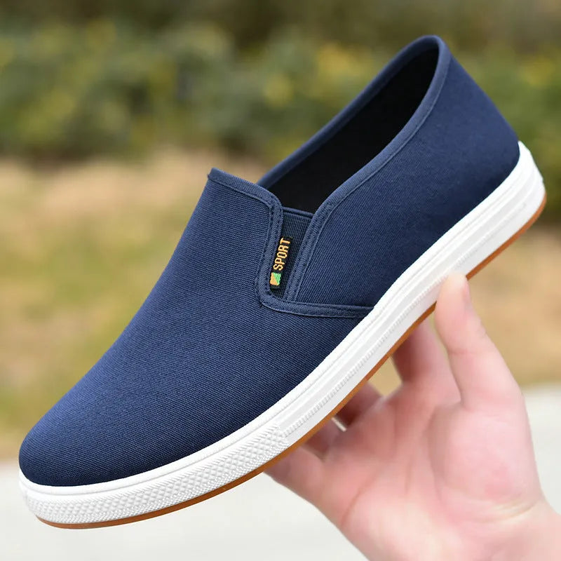 Men's low-top canvas slip-on cloth shoes in black or blue with round toe and composite sole
