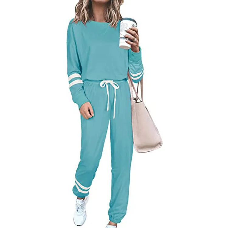 Women's plus size loose-fitting casual suit in a solid colour with long sleeves and matching trousers.