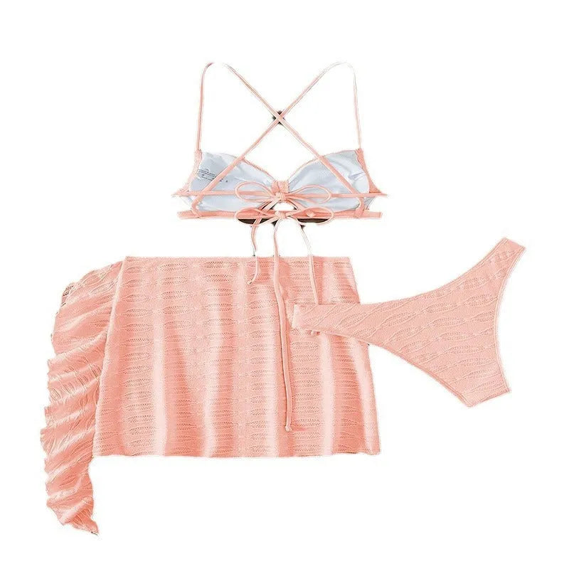 Women's lace-up bikini three-piece swimsuit set in light pink with swimsuit top, tie pants, and coordinating skirt