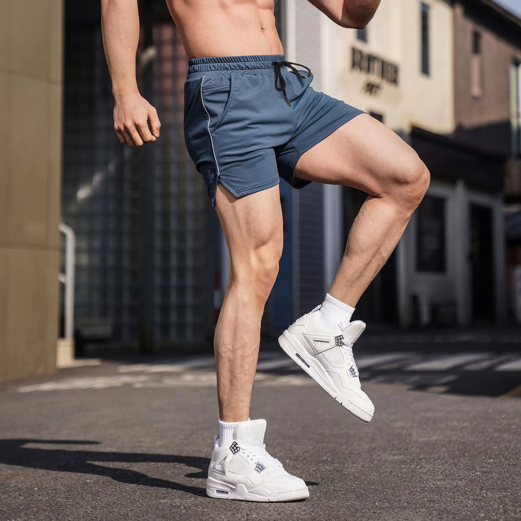 Men's black polyester straight-leg sports casual shorts on a neutral background.