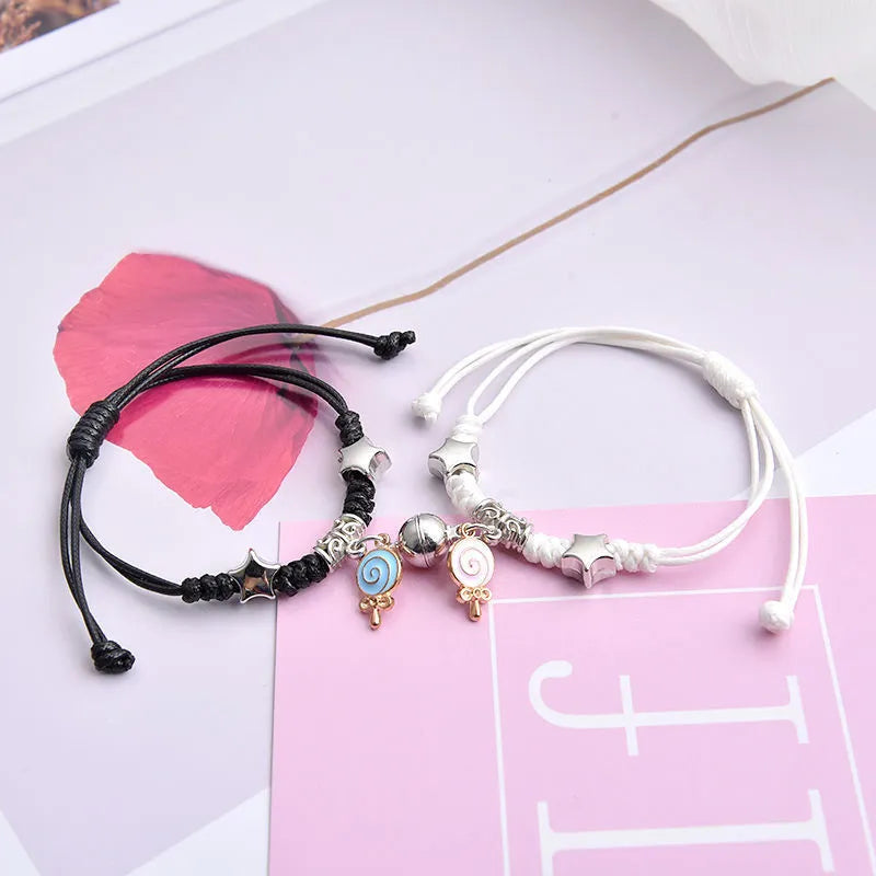 Alloy magnetic suction bracelet pair for couples with symbolic design options