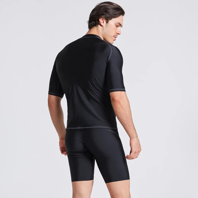 Men's quick-drying half sleeve swim top and pant set in nylon fabric on a white background.