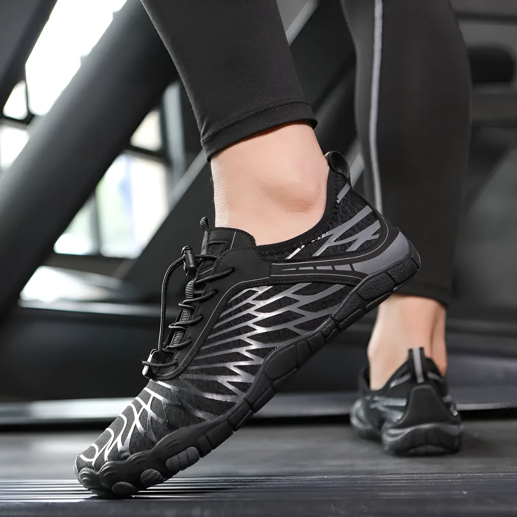 White and black lace-up outdoor sports shoes with a rubber sole on a plain background
