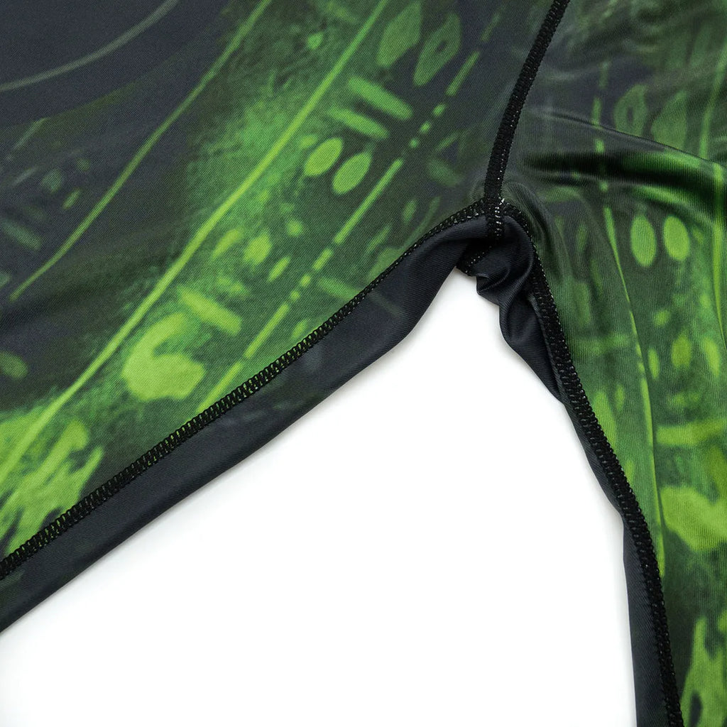 Man wearing a slim-fit, long sleeve printed sports suit for running or fitness training.