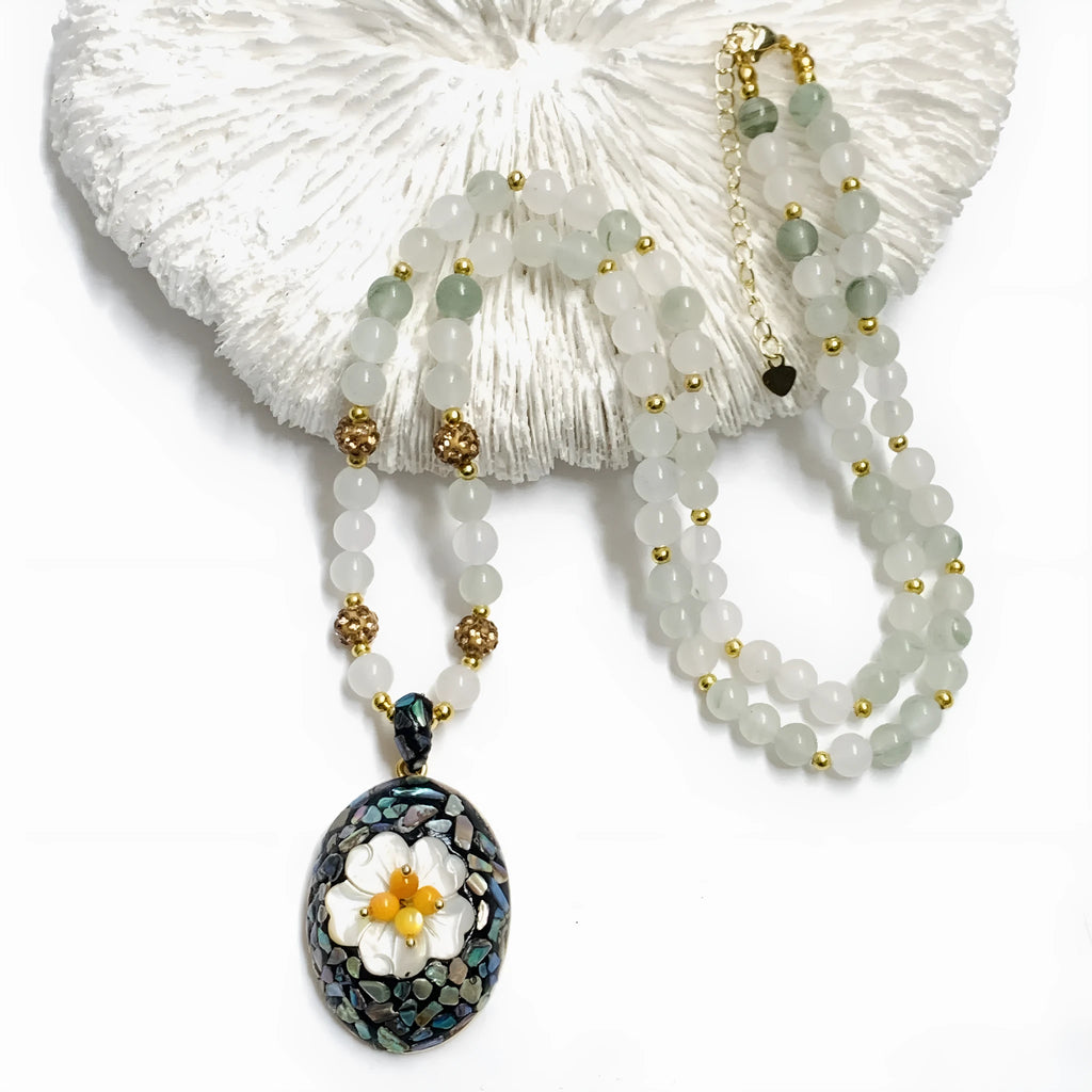 Original design mother-of-pearl shell necklace with rhinestone accents and twist chain