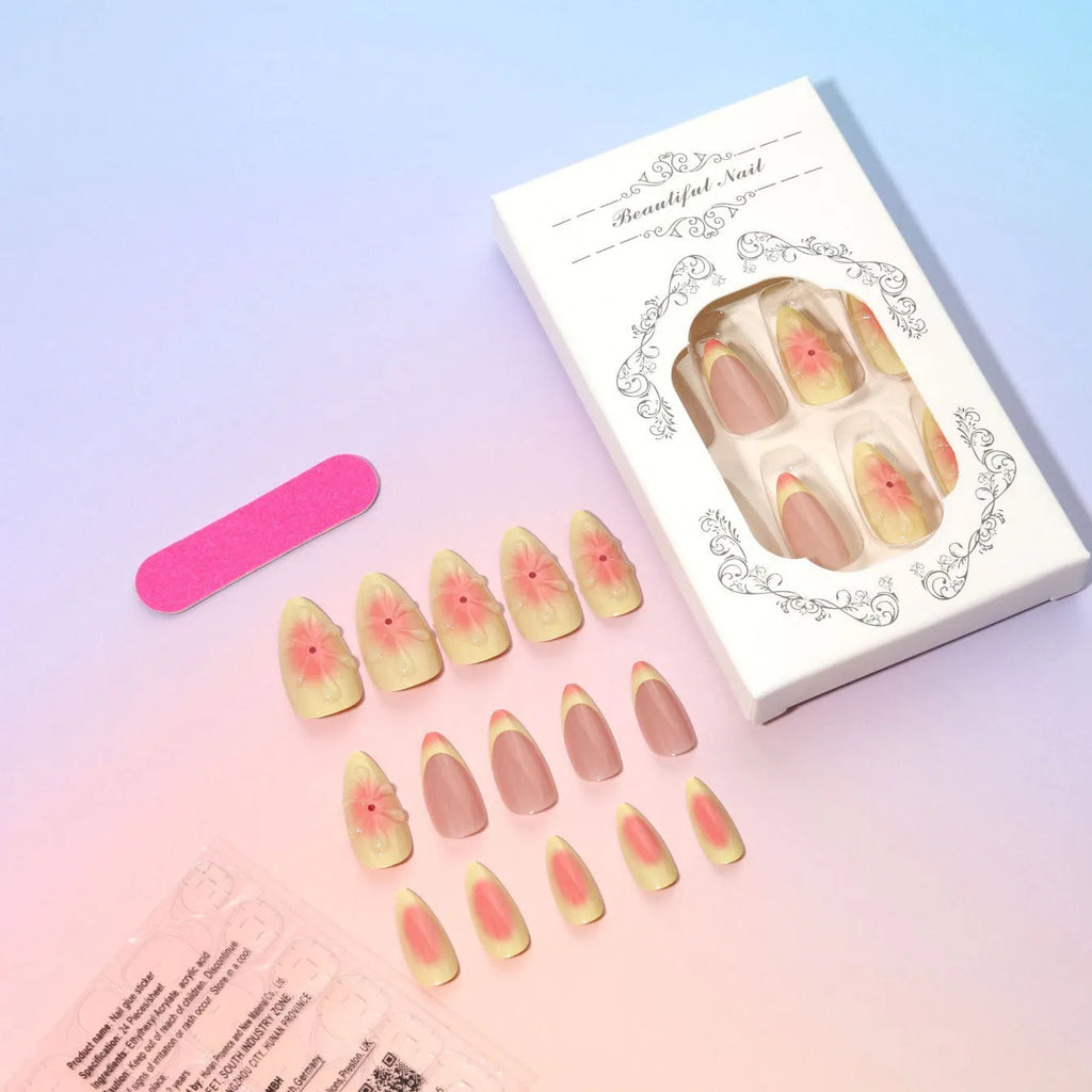 Set of fake nails with colourful 3D cartoon flower designs, jelly glue, and a nail file on a pink background.