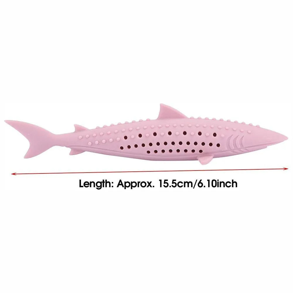 Green silicone fish-shaped cat chew toy with side holes on a white background.