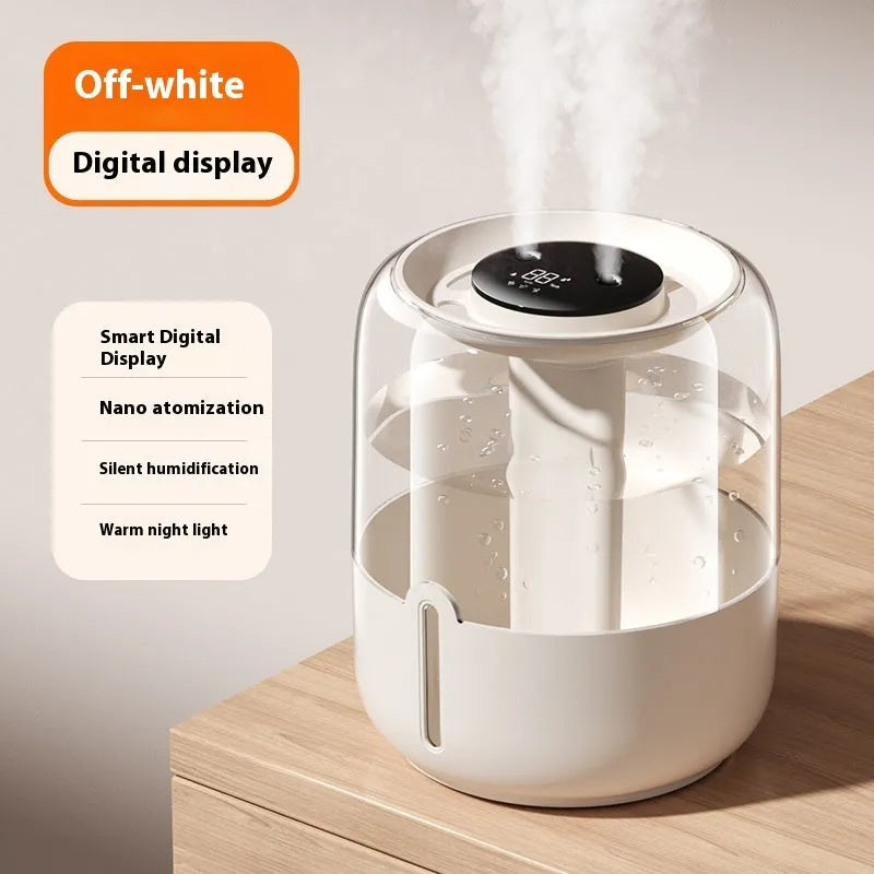 Beige round USB humidifier with dual spray nozzles and digital humidity display on a desk