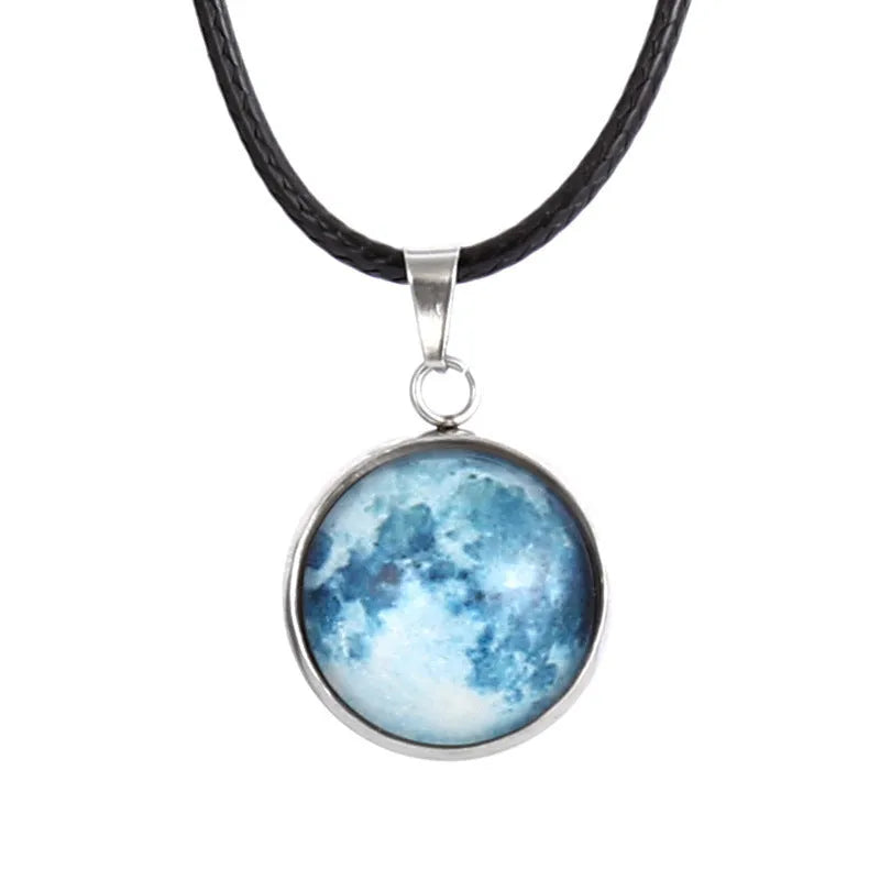 Luminous moon and constellation night sky pendant on an extendable alloy necklace chain.