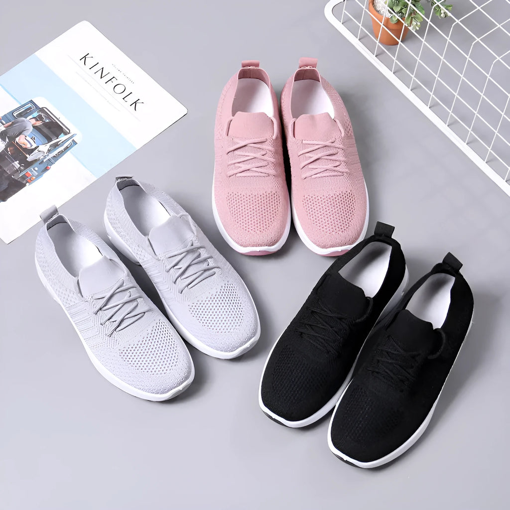 Women's solid colour mesh sneaker with round toe and lace-up front, on a non-slip PVC sole.