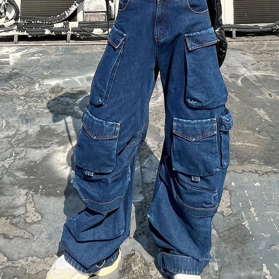 Dark blue distressed women's wide-leg jeans with a high waist and multiple pockets on a mannequin.