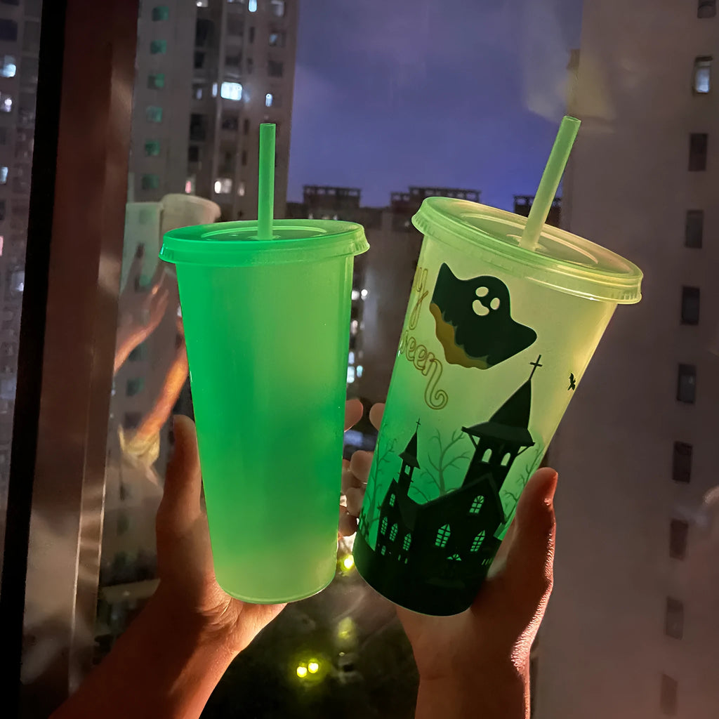 A luminous Halloween-themed plastic sippy cup with a straw, showing its 720ml cylindrical shape.