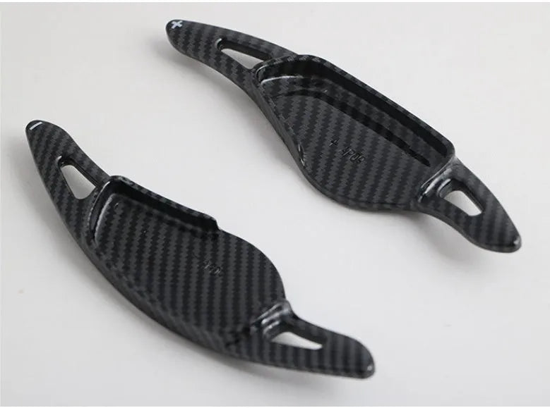 Carbon fibre pattern steering wheel paddle shift modification kit for car interior.
