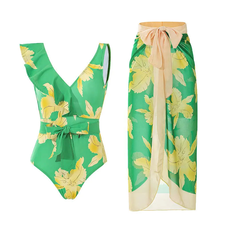 Women's solid colour one-piece swimsuit with spaghetti straps and a matching skirt laid flat.