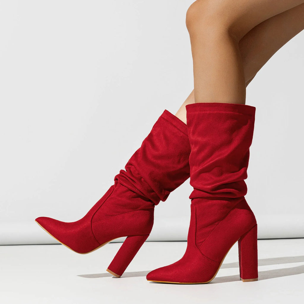 Women's black suede chunky heel boots with pointed toe and mid calf length.