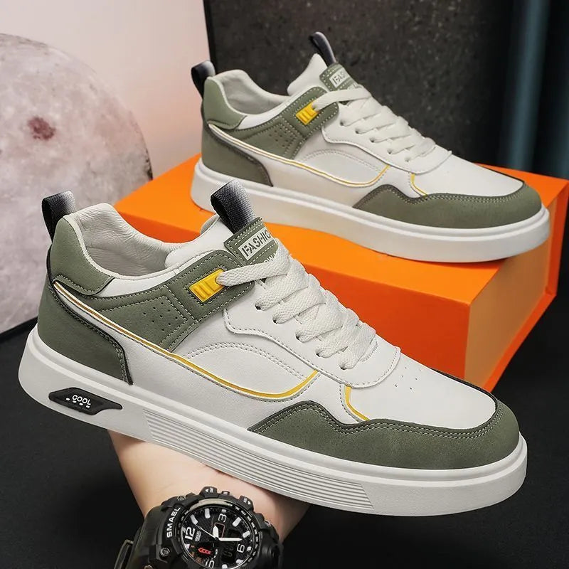 Men's low-top canvas board shoes in solid colour with leather stitching detail on a neutral background.