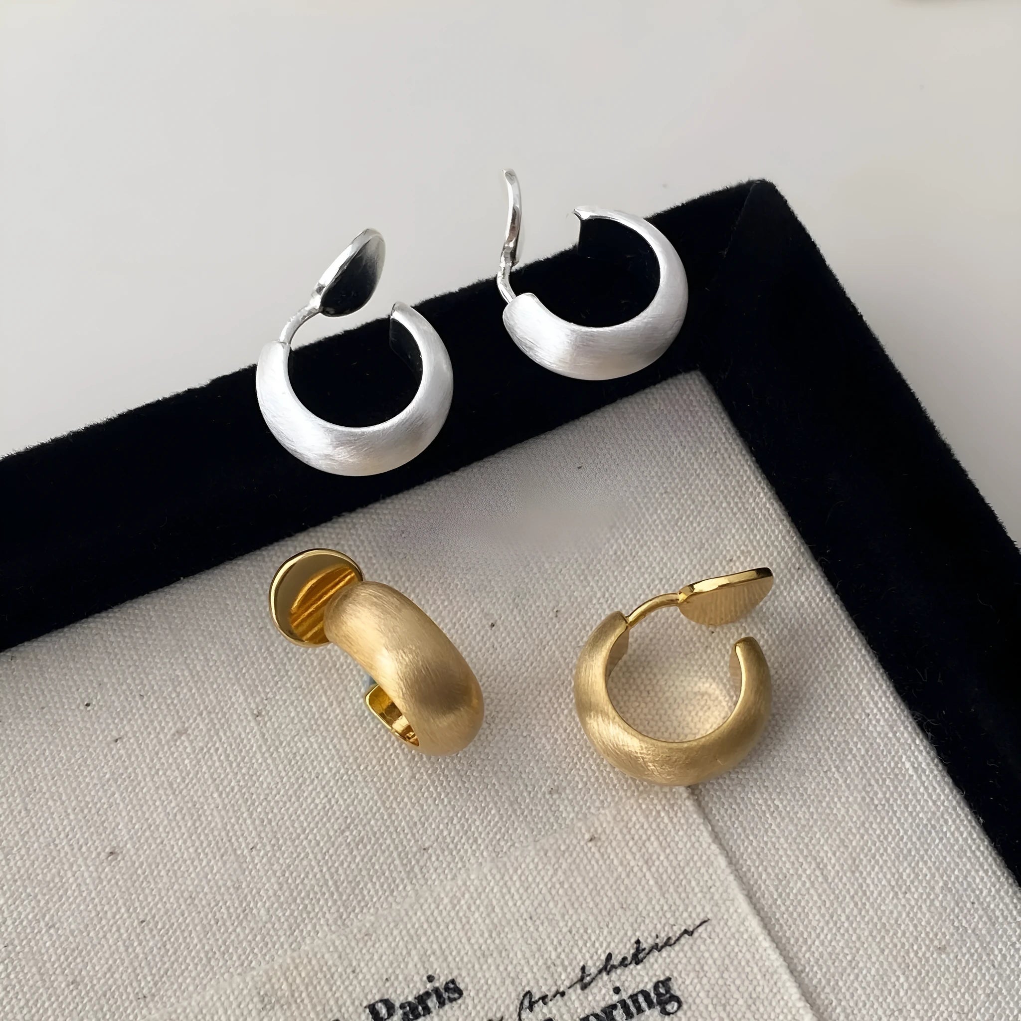 Geometric C-shaped brushed copper earrings with frosted finish available in gold or silver for women