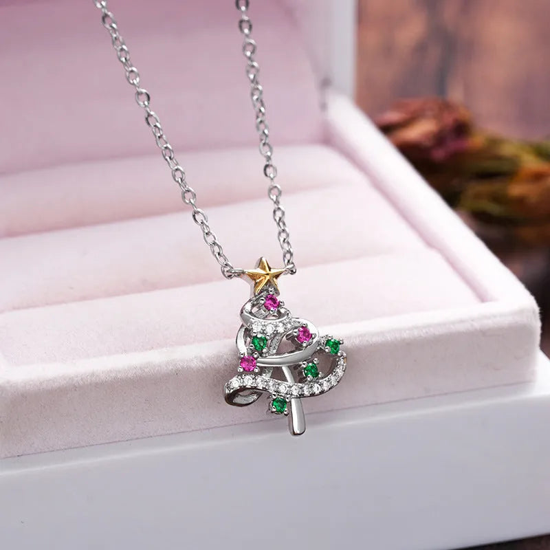 Two-tone copper Christmas tree necklace with inlaid zircon and adjustable O-ring chain on white background