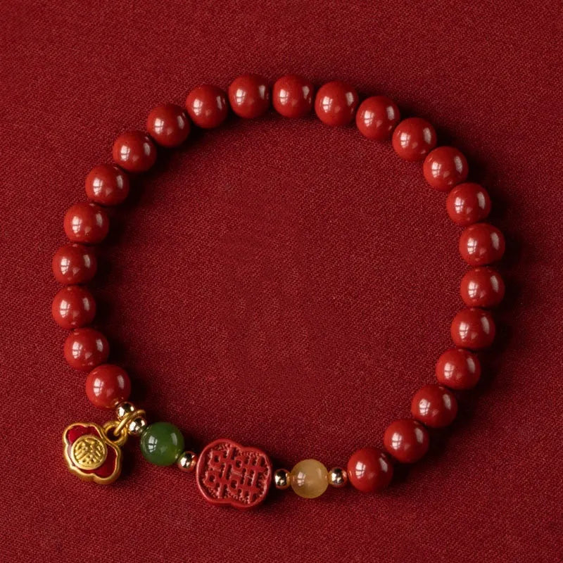 Emperor sandstone cinnabar bracelet with fu character and happy eyebrow design