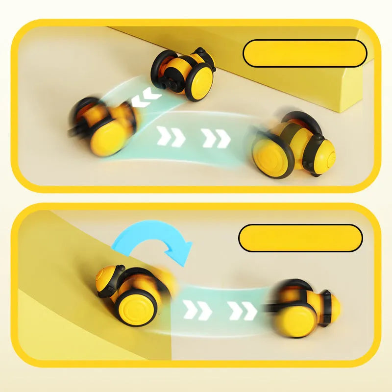 Pink and yellow bee-themed electric cat toy with feather attachment on floor