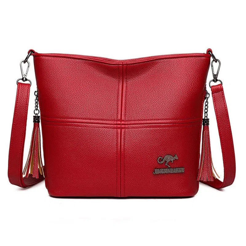 PU soft-leather-texture crossbody bag in red with stitching and tassels, horizontal shape, large capacity
