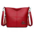 PU soft-leather-texture crossbody bag in red with stitching and tassels, horizontal shape, large capacity